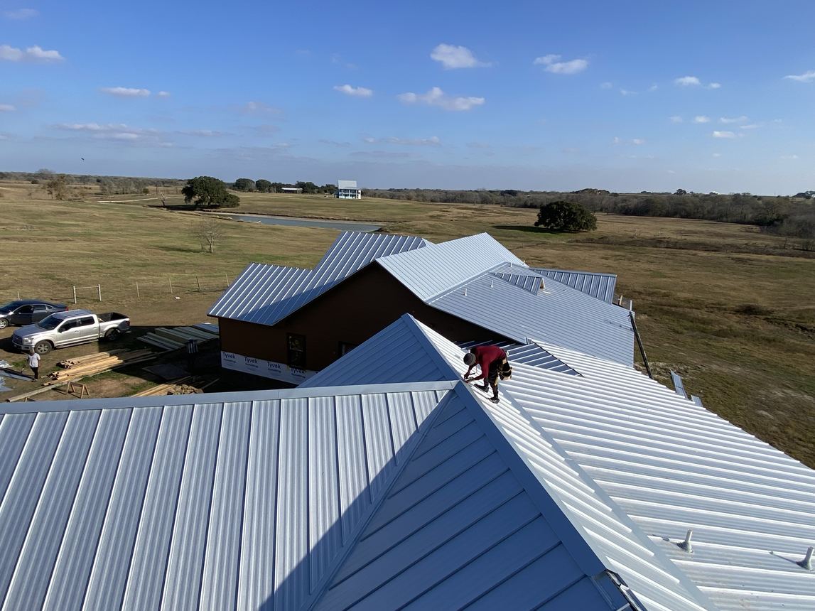 Aerial view of a standing-seam metal roof installed by TMR in Central Texas